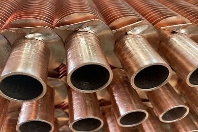Photo of stacked Copper Tubes .
