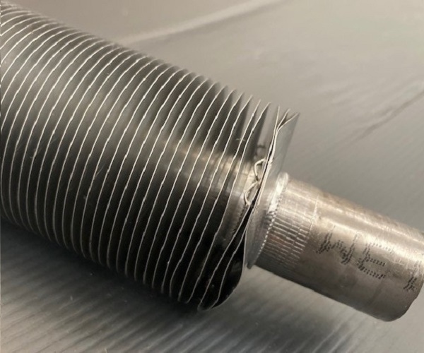 Photo of a single aluminium 'L' fin tube.